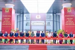 Party General Secretary To Lam, Minister of Public Security Luong Tam Quang and other Party and State leaders and former leaders cut the ribbon to inaugurate the Ministry of Public Security's Headquarters. (Photo: VNA)