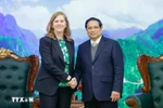 Prime Minister Pham Minh Chinh meets with Lynn Maxwell, Global Chief Commercial Officer at S&P Global Ratings, in Hanoi on February 26 (Photo: VNA)