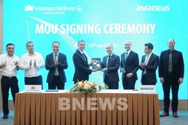 At the signing ceremony between Vietbam Airlines and Amadeus IT Group (Photo: VNA)
