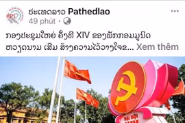 An article on the 14th National Congress of the Communist Party of Vietnam published by the Lao News Agency (Photo: VNA)