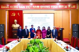 Representatives from the Ho Chi Minh Relic Site at the Presidential Palace and Saint Petersburg State University of Russia at the MoU signing ceremony. (Photo: VNA)