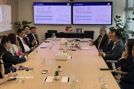 Vietnamese Ambassador to France Trinh Duc Hai meets with representatives of FPT at its office in the La Défense area of Paris on March 10. (Photo: VNA)