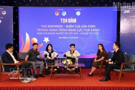 A seminar at the programme (Photo: VNA)