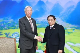 PM Pham Minh Chinh (R) and Portuguese Foreign Minister Joao Gomes Cravinho (Photo: VNA)