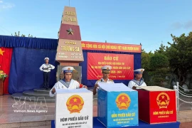 Soldiers examine ballot boxes before voting at a polling station in Truong Sa special zone, Khanh Hoa province. (Photo: VNA)