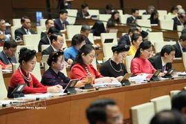 Female deputies of the National Assembly attend the opening session of the ninth sitting of the 15th National Assembly on May 5, 2025. (Photo: VNA)