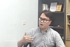 Malaysia-based researcher Enzo Sim Hong Jun grants an interview to the Vietnam News Agency. (Photo: VNA)