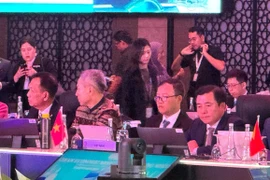 Deputy Minister of Industry and Trade Nguyen Sinh Nhat Tan (first from right) at the 57th AEM Meeting. (Photo: VNA)