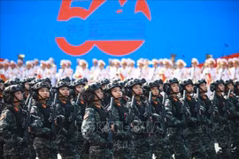 Female special police officers at the parade marking the the 50th anniversary of the Liberation of the South and National Reunification on April 30. (Photo: VNA)