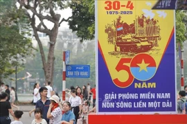 A banner marking the 50th anniversary of the Liberation of the South and National Reunification (Photo: VNA)