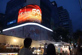 Images celebrating the 50th anniversary of Saigon–Gia Dinh officially being renamed Ho Chi Minh City (July 2, 1976 – 2026) are displayed on large electronic billboards in some of Seoul's busiest commercial and tourist areas. (Photo: VNA)