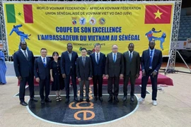 Vietnamese Ambassador to Algeria and Senegal Tran Quoc Khanh (centre) in a group photo at a recent annual Ambassador's Vovinam Cup held in Senegal. (Photo: VNA)