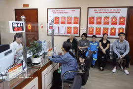 The two-tier local administration model has received strong support from citizens and businesses. (Photo: VNA)