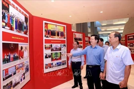 Deputy Prime Minister Mai Van Chinh (2nd from right) inspects preparations for the exhibitions on October 11. (Photo: VNA)