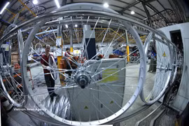 An automated bicycle rim inspection machine (replacing work previously carried out by 20 workers) at Hanoi Thong Nhat JSC. (Photo: VNA)