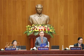 Politburo member and President of Laos’ ninth National Assembly Xaysomphon Phomvihane delivers the opening address at the session. (Photo: VNA)