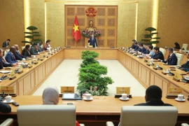 The meeting between Deputy Prime Minister Tran Hong Ha and the delegation of international agriculture ministers and senior officials on July 15 (Photo: VNA)
