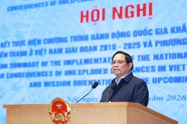 Prime Minister Pham Minh Chinh speaks at the conference in Hanoi on January 13. (Photo: VNA)