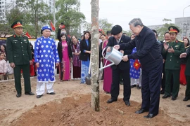 Party General Secretary To Lam and delegates plant trees at the festival. (Photo: VNA)