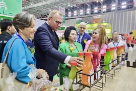 Representatives of domestic and foreign business associations visit a booth at Vietfood & Beverage – Propack Vietnam 2025. (Photo: VNA)