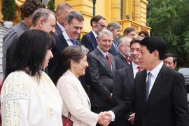 State President Luong Cuong (right) welcomes EU diplomats at the meeting in Hanoi on June 9. (Photo: VNA)