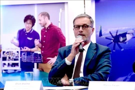 French Ambassador Olivier Brochet speaks at the press conference in Hanoi on December 11 to mark the 10th anniversary of the Paris Agreement on climate change and highlighting the COP30 outcomes. (Photo: VNA)