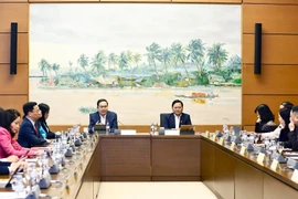 National Assembly Chairman Tran Thanh Man (left, centre) in the group discussion. (Photo: VNA)