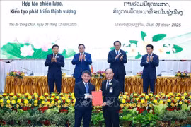 At the signing and exchange of cooperation agreements (Photo: VNA)