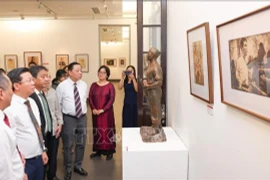 People visit the art exhibition to honour generations of contributors to national independence begins at the Vietnam Fine Arts Museum in Hanoi on August 15. (Photo: VNA)