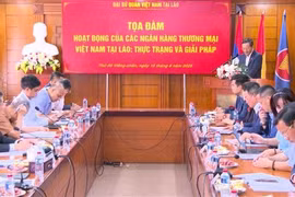 An overview of the seminar to look into operations of Vietnamese banks in Laos. (Photo: VNA)
