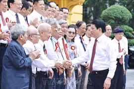 State President Luong Cuong meets with veteran and outstanding journalists on June 20. (Photo: VNA)