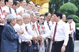 State President Luong Cuong meets with veteran and outstanding journalists on June 20. (Photo: VNA)