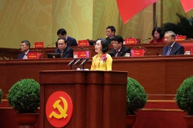 NA Vice Chairwoman Nguyen Thi Thanh delivers a presentation at the plenary discussion of the ongoing 14th National Party Congress on January 21. (Photo: VNA)