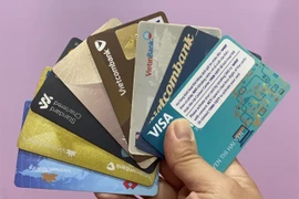 From July 1, all domestic transactions via magnetic‑stripe cards, including the stripe on hybrid chip cards, are switched off. (Photo: VNA)