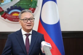 Lao Foreign Minister Thongsavanh Phomvihane shares about the role of Vietnam's revolutionary press. (Photo: VNA)