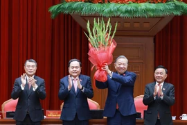 General Secretary of the 13th Party Central Committee To Lam (second, right) is re-elected as the Party chief for the 2026 – 2031 term at the first meeting of the 14th Party Central Committee on January 23 morning. (Photo: VNA)
