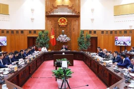 Prime Minister Pham Minh Chinh chairs a meeting on the implementation of the Long Thanh international airport project. (Photo: VNA) 