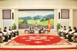 At the meeting between Vietnamese Minister of Justice Nguyen Hai Ninh and Lao Party General Secretary and State President Thongloun Sisoulith. (Photo: VNA)