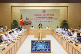 Prime Minister Pham Minh Chinh, who is also Head of the National Civil Defence Steering Committee, chairs the committee’s first national meeting on disaster prevention and control, and search and rescue efforts on July 24. (Photo: VNA)