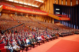 Delegates attend the closing session of the 14th National Congress of the Communist Party of Vietnam. (Photo: VNA)