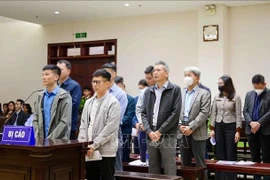 Defendants in the case involving Thuan An Group and several related units and localities at the appellate court in Hanoi on December 18 (Photo: VNA)
