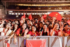 Enthusiastic audience members at a live music show in Hanoi. (Photo: VNA)