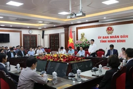 At the working session (Photo: VNA)