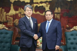 Prime Minister Pham Minh Chinh and Chairman of Japan Bank for International Cooperation Maeda Tadashi. (Photo: VNA)