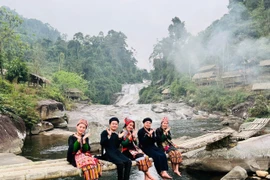 People visit the seven-layer waterfall in Que Phong district, Nghe An province. (Photo: VNA)