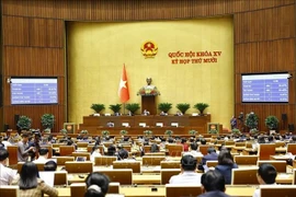 The National Assembly votes to adopt the law amending and supplementing a number of provisions of the Law on Corruption Prevention and Control. (Photo: VNA)