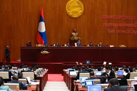 At the 9th Lao National Assembly's 9th session (Photo: qdnd.vn)