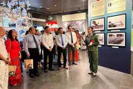 People visit the special exhibition entitled “From the Paris Peace Accords to the Spring 1975 Victory” at the War Remnants Museum in Ho Chi Minh City. (Photo: sggp.org.vn)