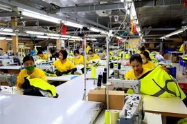 Workers at a textile company in Ho Chi Minh City (Photo: VNA)
