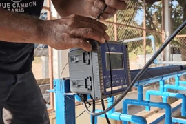 Installation of sensor tracker to monitor water pH, an early step toward smarter aquaculture operations. (Photo: The Courtesy of Aquaculture of Lao)